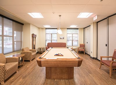 Common area with a pool table and seating