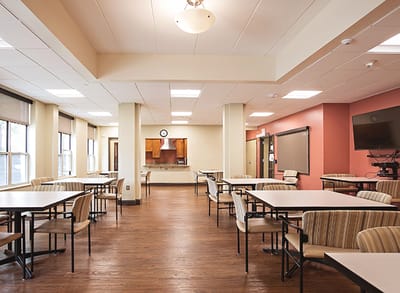 Bright dining area with tables and seating.