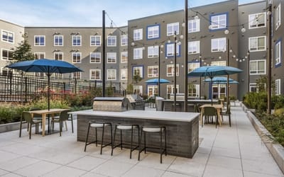 Outdoor courtyard with seating and umbrellas