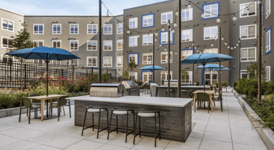 Outdoor patio area with seating and umbrellas