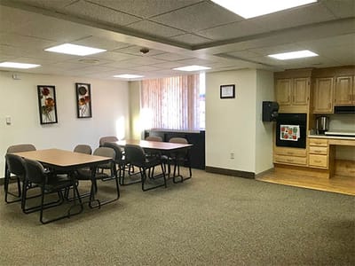 Interior common area with dining setup.