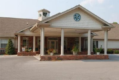 Entrance of a senior living facility with a porch