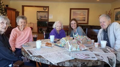 Residents and staff enjoying an activity together.