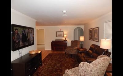Common area with seating and a television