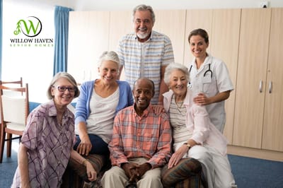 A diverse group of residents and staff smiling together