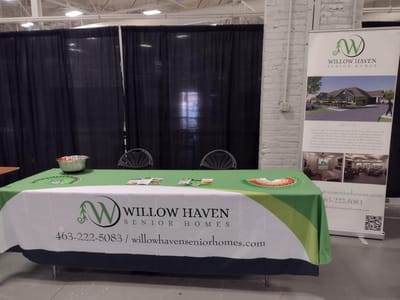 Logo of Willow Haven Senior Homes on a display table