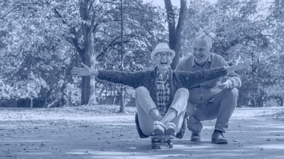 Seniors enjoying a playful moment outdoors