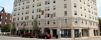 Facade of Bixby Brockton with people walking by
