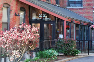 Exterior view of a building entrance with landscaping