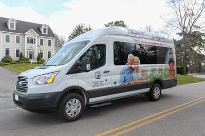 Facility transport van decorated with resident images