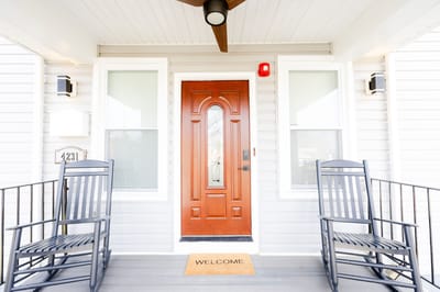Front entrance of the assisted living facility with welcome mat