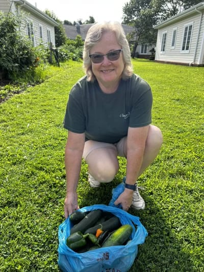 Resident harvesting vegetables in the garden