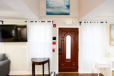 Well-lit interior of a facility lobby with a decorative entrance