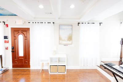 Bright interior view of a common area with piano