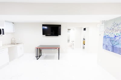Bright interior room with a TV and table