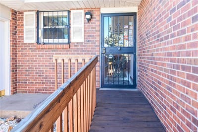 Entrance to a senior living facility with wooden ramp