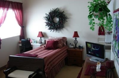Cozy resident room with bed and decor