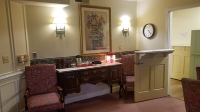 Cozy common area with floral decor and seating