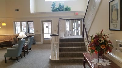 A warm, inviting interior common area with seating