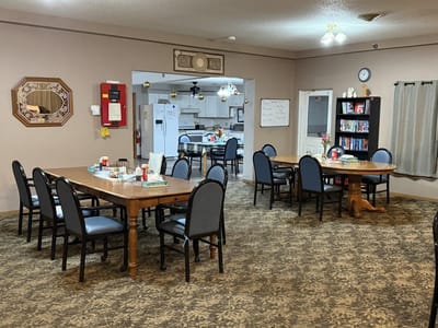 Dining area with tables and chairs set up for residents