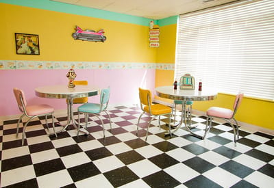 Retro-style dining area with colorful decor and tables