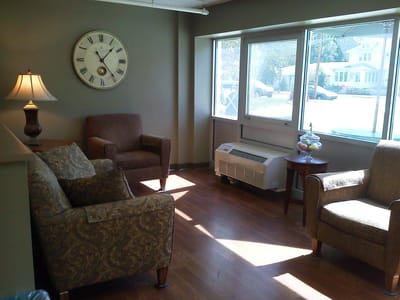 A cozy common area with comfortable seating and natural light