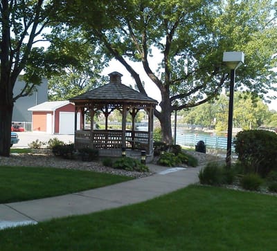A gazebo in a green outdoor space