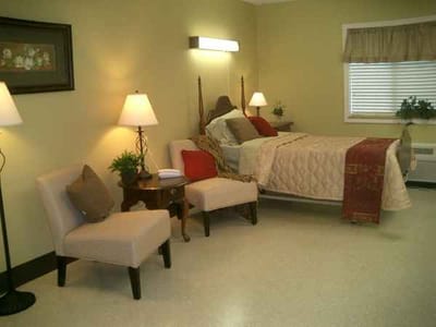 Well-furnished resident room with natural light