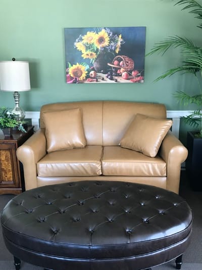 Cozy living room area with a sofa and artwork