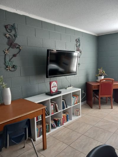 Interior common area with seating and bookshelves