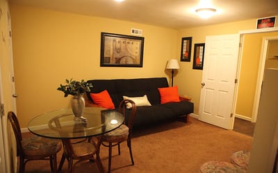 Cozy interior of a resident's living area with a sofa and table