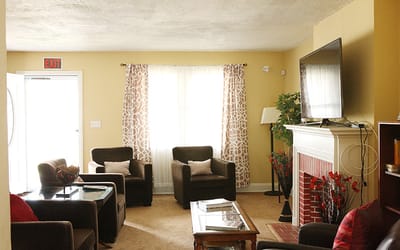 Cozy common area with seating and television