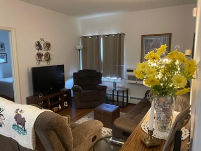 Cozy living area with comfortable seating and a TV