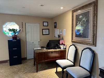 Interior office space with desk and decorative wall art