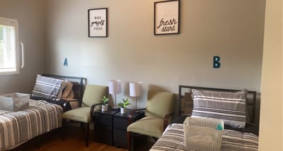 Cozy shared resident room with two beds and decor
