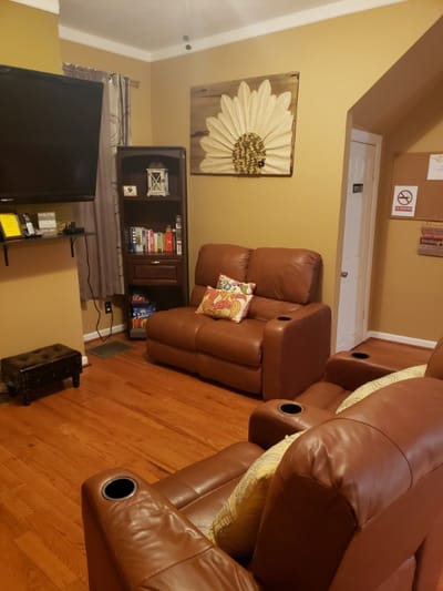 Cozy lounge area with leather chairs and decor