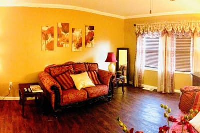 Cozy common area with floral decor and a couch