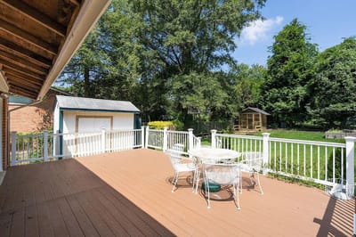 Deck area with outdoor furniture and garden