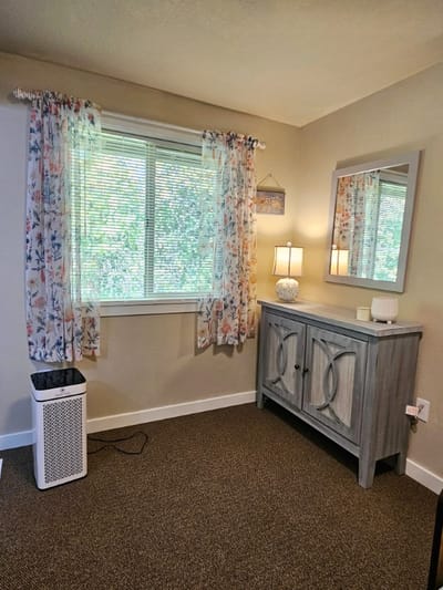 Cozy interior of a resident's room with lamp and decor