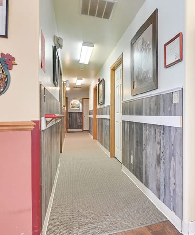Interior hallway with framed pictures on the walls