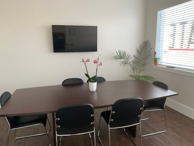 Bright meeting room with a table and chairs