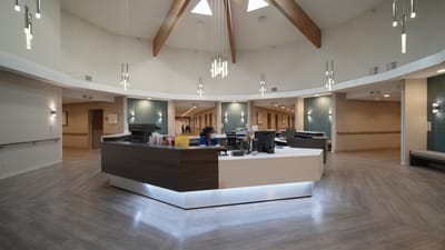 Reception area of a nursing and rehab facility with staff member