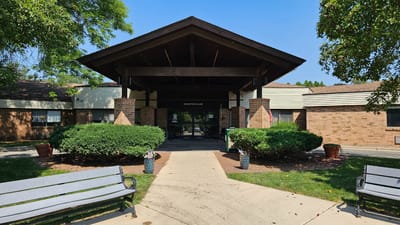Entrance to Middleton Village Nursing and Rehab with landscaping