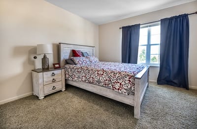 A cozy bedroom setup with floral bedding