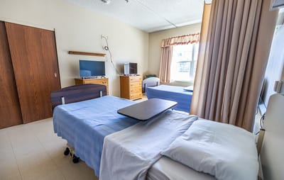 Interior of a shared resident room with two beds
