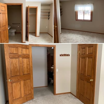 Empty room with a closet and bathroom visible