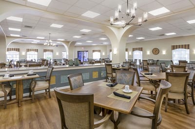 Bright dining room with tables set for meals