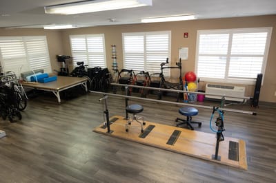 Physical therapy room with equipment and wheels
