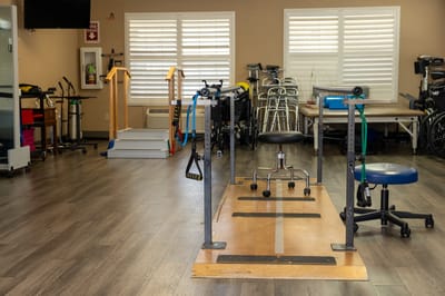 Rehabilitation area with equipment in a therapy room