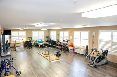 Interior view of a rehabilitation room with exercise equipment